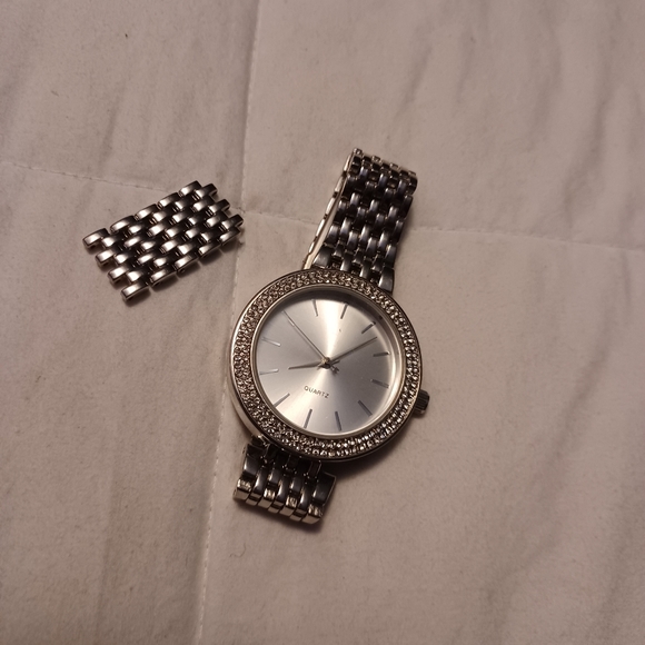Silver watch with diamonds around it - Picture 2 of 4
